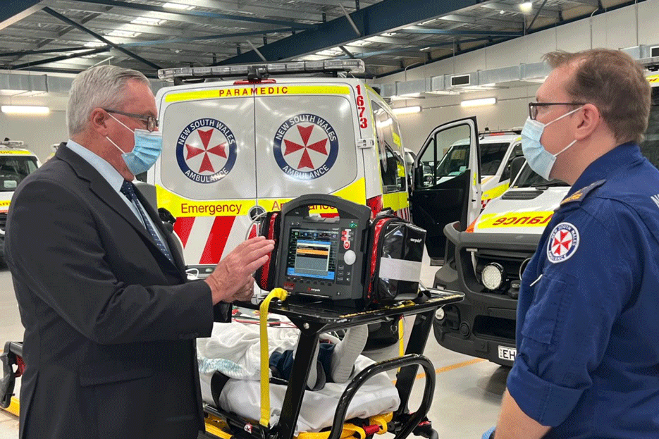 Health Minister Brad Hazzard and Paramedic Nick demonstrating the corpuls device at Haberfield Ambulance Station.