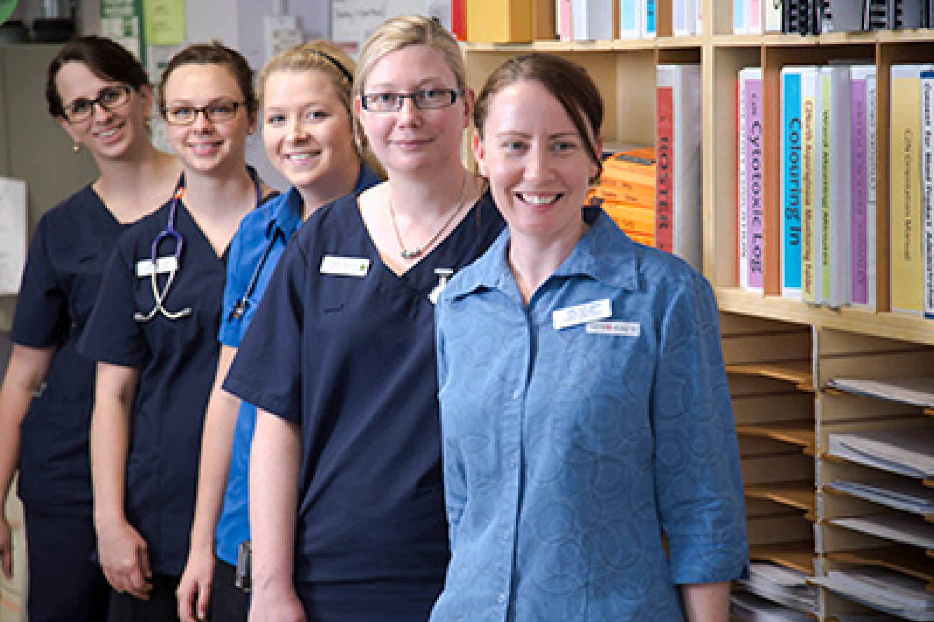 Group of smiling female clinicians
