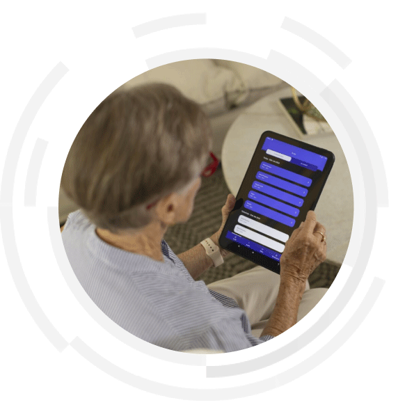 Woman signing into the RPM platform through a tablet
